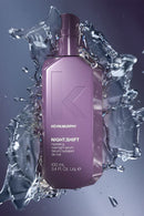 Kevin Murphy Night Shift serum bottle surrounded by water splashes on a dark background - Hair Care Canada