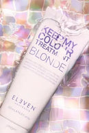 Bottle of 'Keep My Colour Treatments' by Eleven Australia on a colorful, reflective background - Hair Care Canada