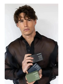 Man holding three business cards against a white background - Hair Care Canada