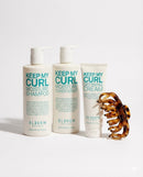 Set of 'Keep My Curl' hair care products including shampoo, conditioner, and cream with a tortoiseshell curling iron on a white background - Hair Care Canada